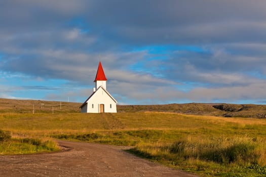 Typical Rural Icelandic Church under a blue summer sky. Horizontal shot