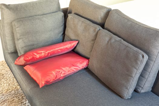 Modern apartments cozy furniture: a sofa with pillows