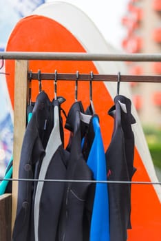 Diving suits and surf boards in a store. France