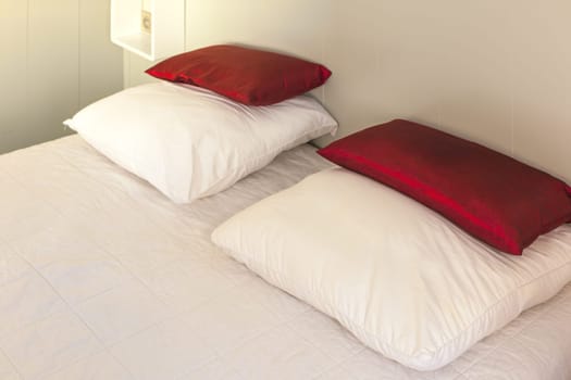 Prepared fresh bed, scene in apartments room. Horizontal shot