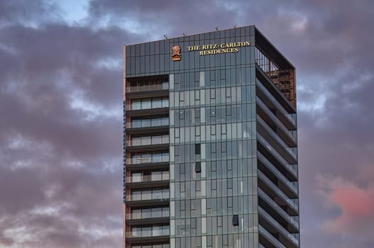 Limassol, Cyprus - January 14, 2024: The modern and luxurious Ritz-Carlton residences building standing tall against a dramatic cloudy sky in Limassol, Cyprus