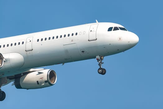 Lufthansa airbus a321 passenger airplane is flying in a clear blue sky