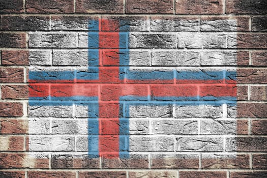 A Faroe Islands flag on brick wall background