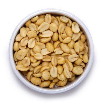 Roasted peanuts in round container on a white background
