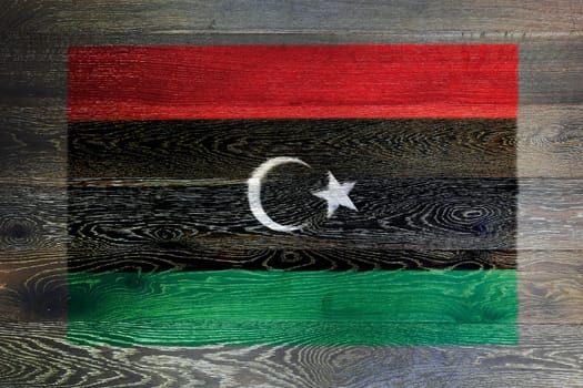 A Kingdom of Libya flag on rustic old wood surface background