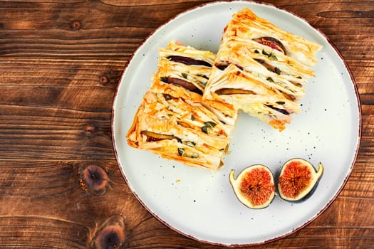 Filo wrapped camembert with figs and brie cheese. Homemade pastries.