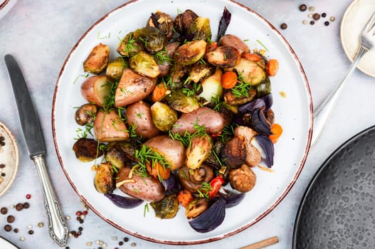 Roasted brussels sprouts and potatoes, food photography. Veggie dish, healthy eating, vegetable still life.