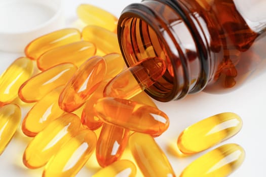 Fish oil or Cod liver oil gel in capsules with omega 3 vitamins, supplementary healthy food