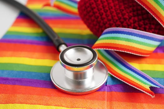 LGBT symbol, Stethoscope with red heart on rainbow flag, rights and gender equality, LGBT Pride Month in June.
