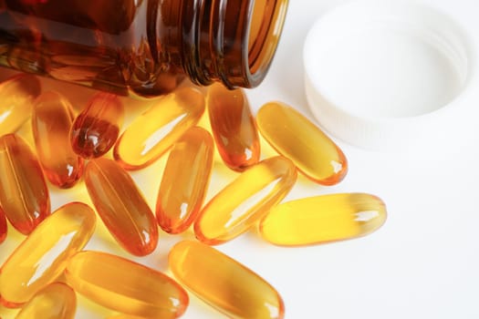 Fish oil or Cod liver oil gel in capsules with omega 3 vitamins, supplementary healthy food