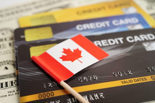 Canada flag on credit card, finance economy trading shopping online business.