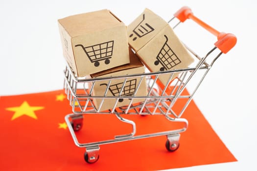 Online shopping, Shopping cart box on China flag, import export, finance commerce.