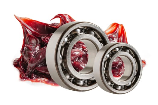 Grease isolated on white backgroud with clipping path, red excellent water resistance synthetic lithium complex grease for moving path and machinery lubrication.