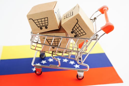 Online shopping, Shopping cart box on Colombia flag, import export, finance commerce.