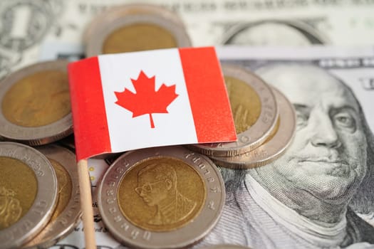 Canada flag on coin and banknote money, finance trading investment business currency concept.