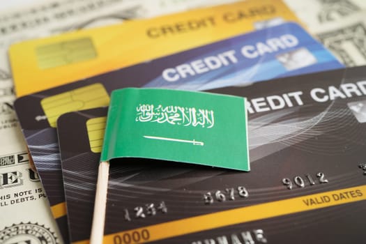 Saudi Arabia flag on credit card, finance economy trading shopping online business.