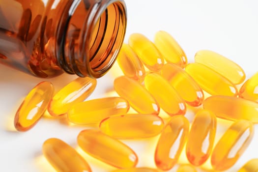 Fish oil or Cod liver oil gel in capsules with omega 3 vitamins, supplementary healthy food