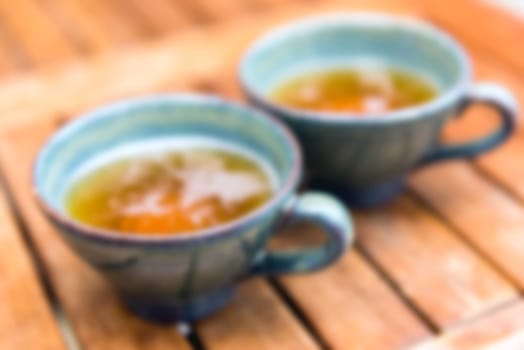 Norman apple cider in a typical ceramic cups. Defocused Shot