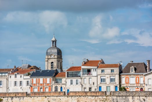 View of the old city wall and houses along the sea in La Rochelle France