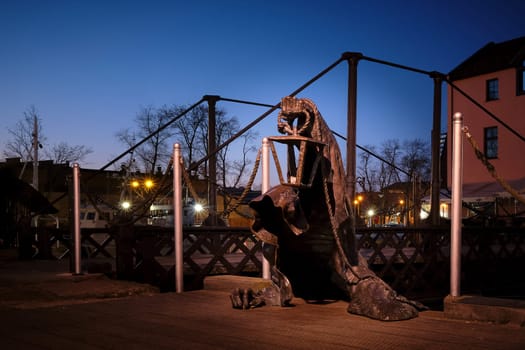 City attraction - statue in old port of Klaipeda, Lithuania. Legend of black no-face ghost with a lantern in gnarled hand come out of harbor waters.