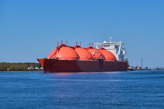 LNG or liquified natural gas tanker entering port on a sunny day in Klaipeda, Lithuania. Alternative gas supply, commercial freight, energy crisis