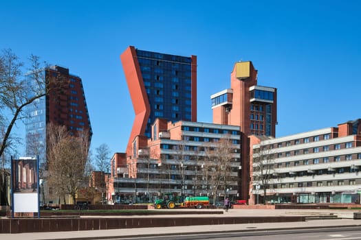 Modern and Soviet buildings in Klaipeda, Lithuania on sunny early spring day.