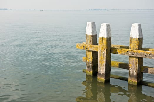 Northern Sea landscape: still water and wooden pier