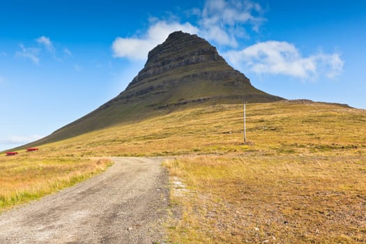 Western Icelandic Kirkjufell mountain landscape under a blue summer sky. Snaefellsnes peninsula