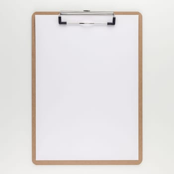 Square top view mock up of workspace desk styled recycled empty clip board with copy space white table background minimal eco style. Concept start up or new day. Presentation, design, text template