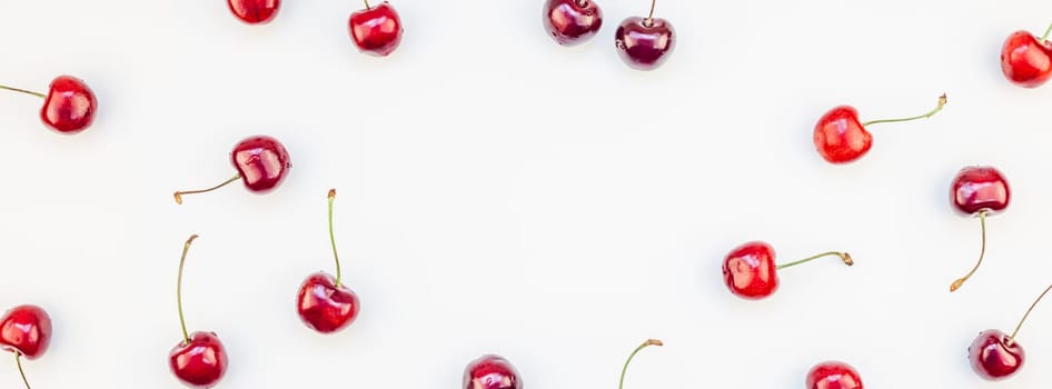 Long wide banner of fresh ripe cherry pattern layout with copy space isolated on white background in minimal style. Concept of summer fun and healthy eating. Template for your text or food design