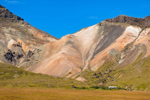 Western Icelandic mountain landscape under a blue summer sky