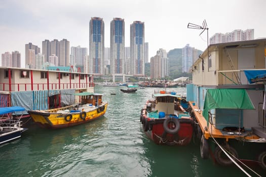 Traditional fishing trawlers in the Aberdeen bay, famous floating village in Hong Kong