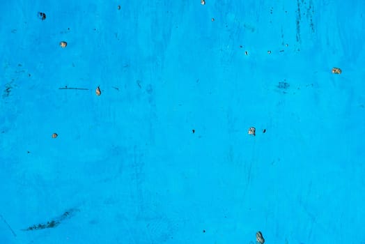 Bright blue painted surface background. Horizontal shot