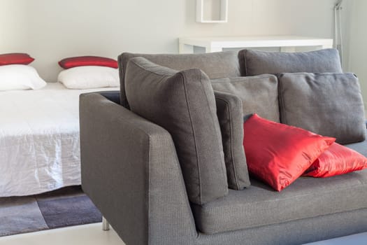 Modern apartments cozy furniture: a sofa with pillows