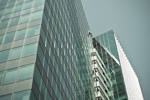 Office glass skyscraper building. Horizontal filtered shot