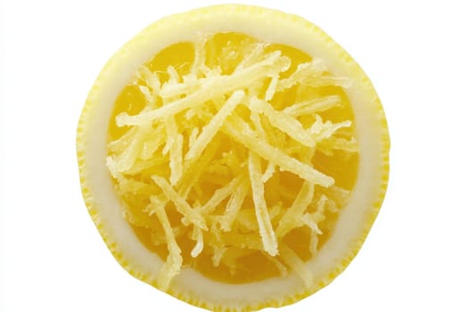 Lemon zest is displayed prominently, revealing bright yellow shavings that offer a burst of citrus aroma. The vibrant zest enhances the visual appeal and invites culinary inspiration.