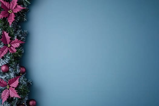Vibrant holiday garlands adorned with pink poinsettias and colorful ornaments are artistically arranged against a clean, solid backdrop. Perfect for festive decorations and celebrations.