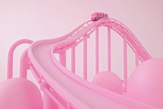 The rollercoaster races along its track, featuring bright pink colors and playful designs.