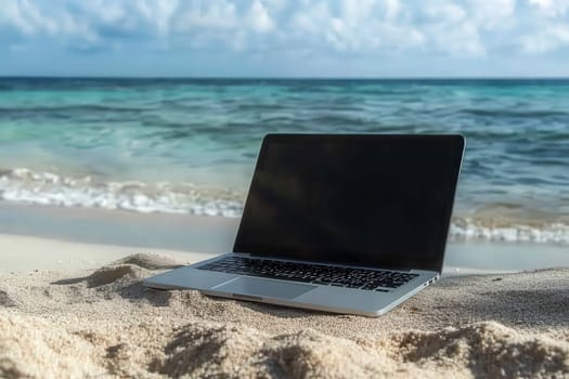 A sleek laptop sits on a sandy beach, inviting productivity amid natures beauty. The tranquil ocean waves create a serene backdrop, perfect for work or relaxation.