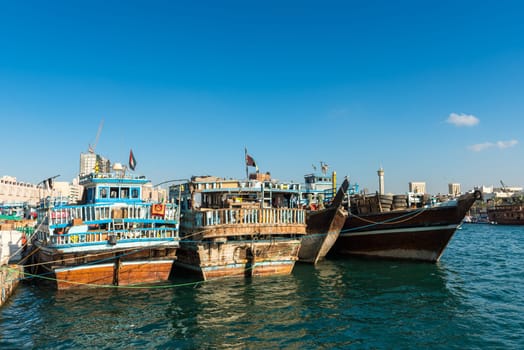 UAE, DUBAI - DECEMBER 27: traditional arabic cargo boats at Dubai creek on December 27, 2014
