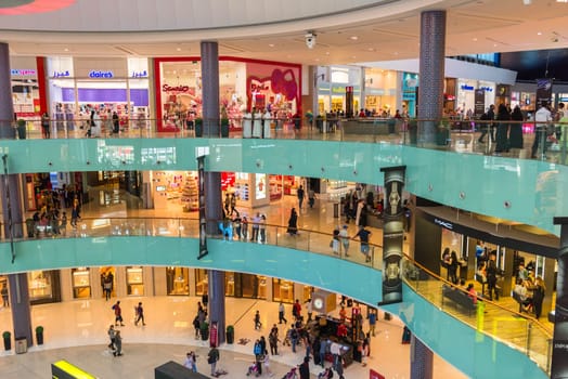 UAE, DUBAI - DECEMBER 25: people do shopping in Dubai Mall store center on December 25, 2014