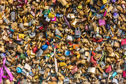 FRANCE, PARIS - JUNE 01: Pont des arts - bridge across Seine river crammed with lovers padlocks on June 01, 2015.