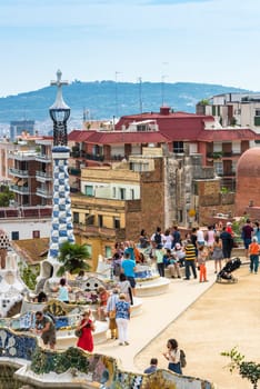 SPAIN, BARCELONA - SEPTEMBER 13: Tourists in Park Guell, Barcelona, Spain on September 13, 2015