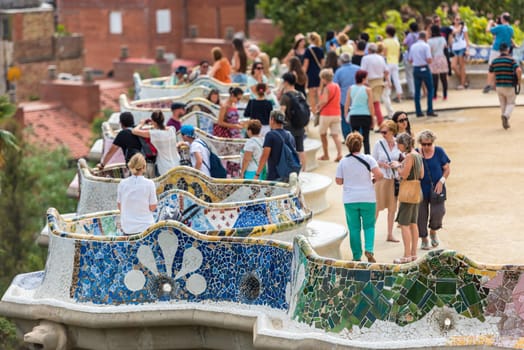 SPAIN, BARCELONA - SEPTEMBER 13: Tourists in Park Guell, Barcelona, Spain on September 13, 2015