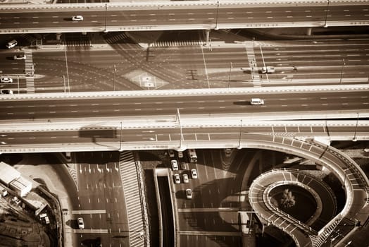 Top view of highway interchange in Dubai, UAE. Sepia toned