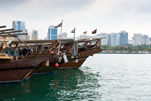Old fishing boats with rusty metal nets in the Persian Gulf