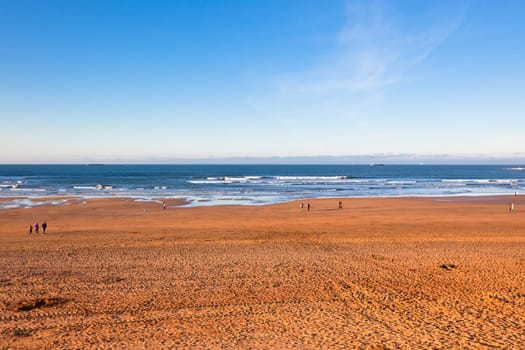 The Bay of Biscay near Bilbao, Spain in January: long beach and ocean before sunset time