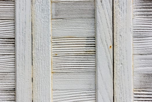 window with closed beige wooden shutters. background photo