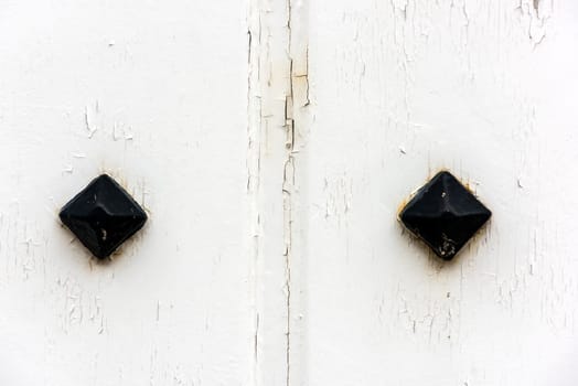 window with closed white wooden shutters. background photo