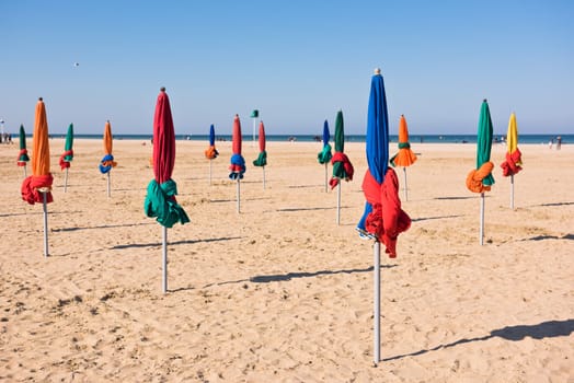 The famous colorful parasols on Deauville beach, Normandy, Northern France